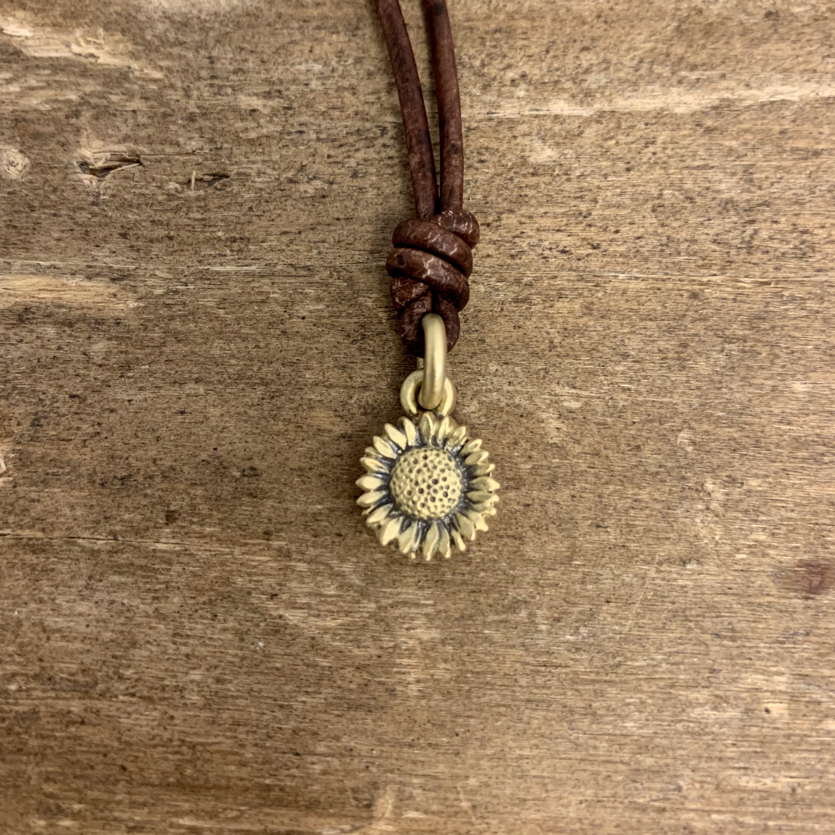 Leathered sunflower bronze necklace